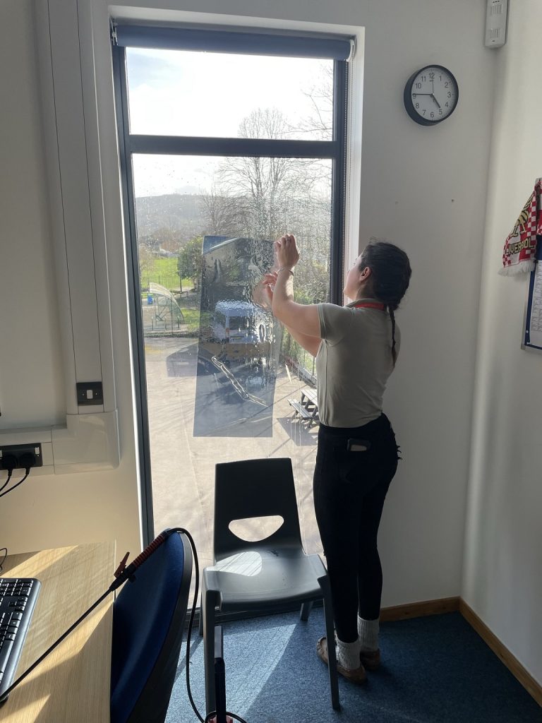 School classroom window film getting prepared for application