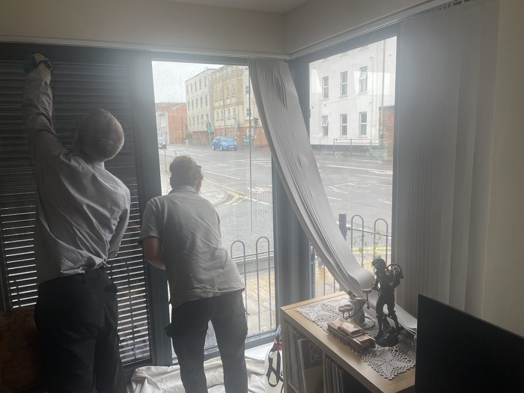 Ground floor flat window film installation in progress