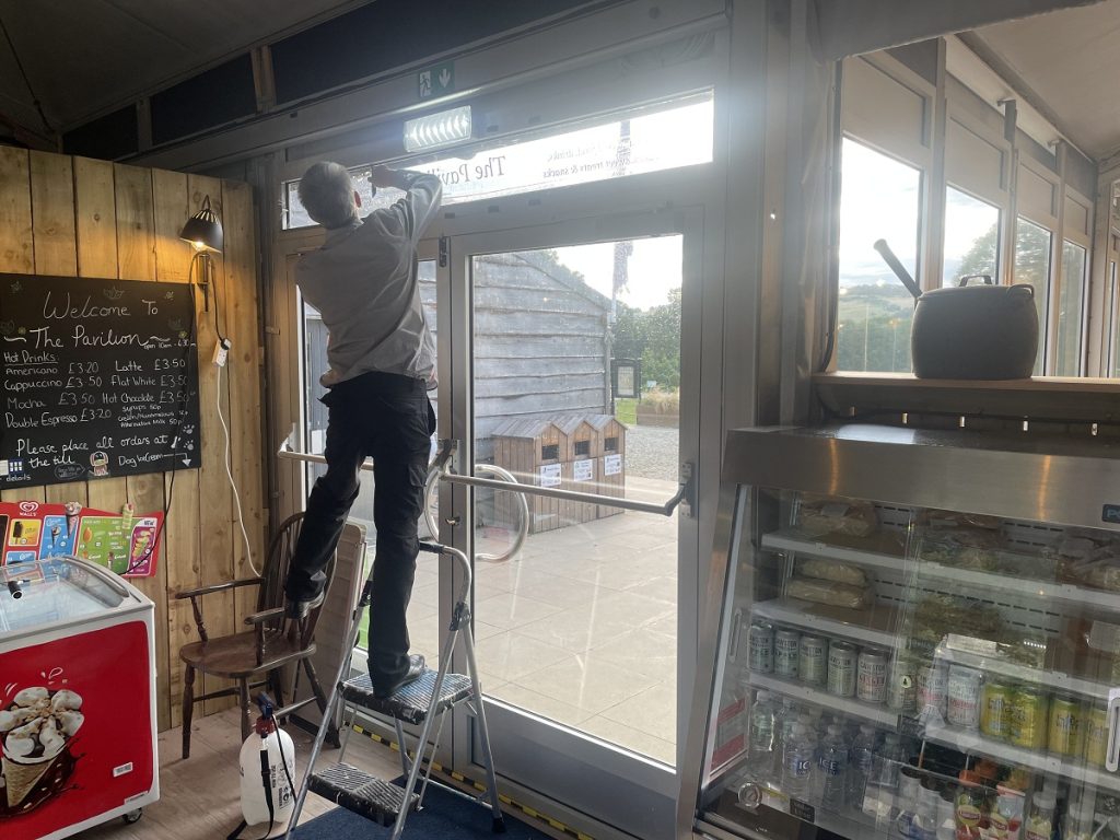 Main entrance to the cafe having window film applied