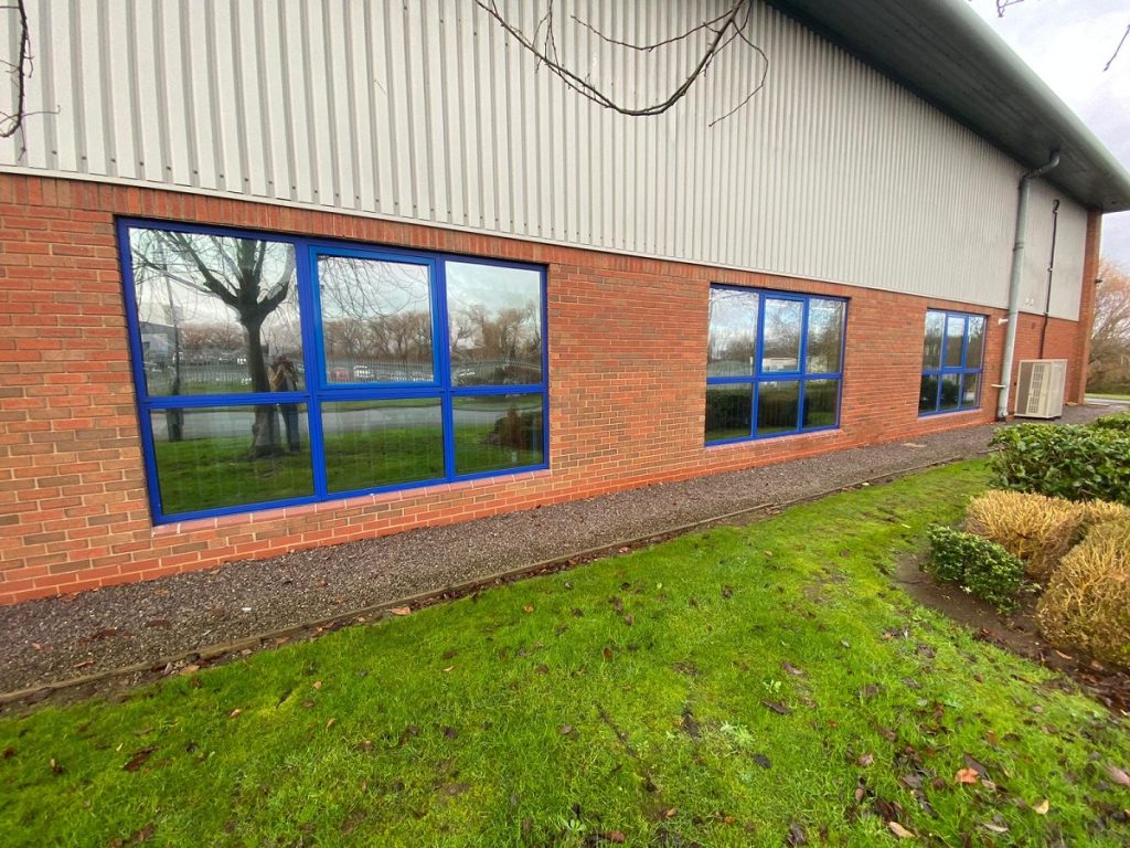 Outside view of 3 banks of windows with energy saving window film installed